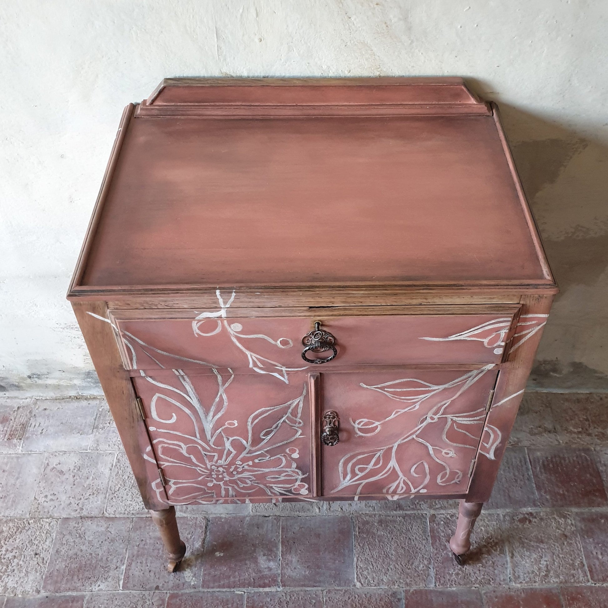1930’s Oak Cabinet featuring a hand painted freeform floral design in white.